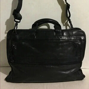 Tumi  unsex black leather Messenger/ work bag